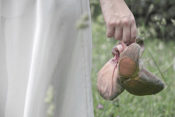 Dancing shoes in the hands of a dancer girl