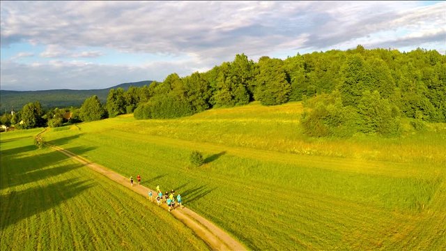 Group of athletes running together on a 10km long nature trail. Aerial drone view.athletes who run 10km / RIBNICA, SLOVENIA,JULY 2 2016