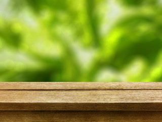 old wood table top on nature green bokeh background
