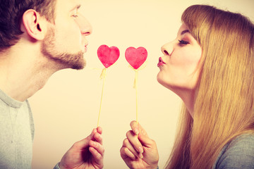 Loving pare with hearts flirting.