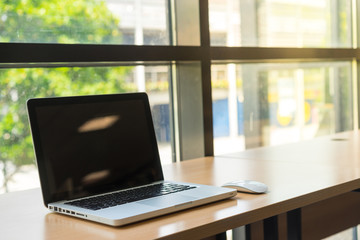 Fototapeta premium Laptop blank screen in the library and office