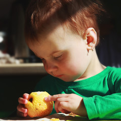 beautiful baby girl eats an apple (bio food, health, healthy lif