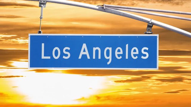 Los Angeles Street sign with time lapse sunset in Southern California.