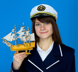 Woman with uniform cap and the ship