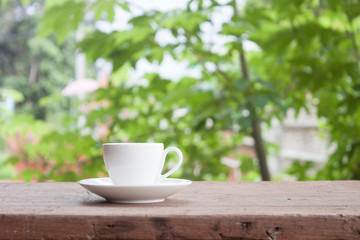 Mini white coffee cup on tabletop