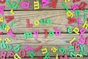 Love my job word on wooden table