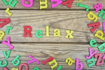 Relax word on wooden table