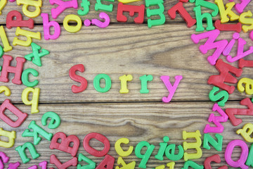 Sorry on wooden table