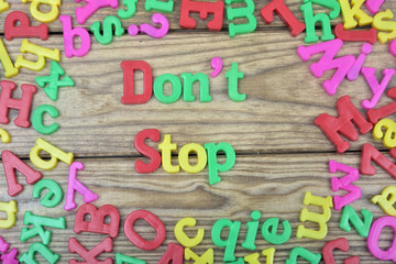 Don't Stop on wooden table
