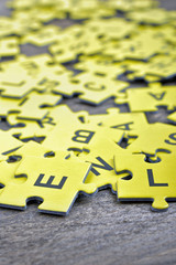 Fototapeta premium Puzzle on wooden table