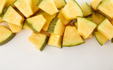 Hamigua Melon cut into slices, Hami Melon, Hami Cantaloupe isolated on white background.