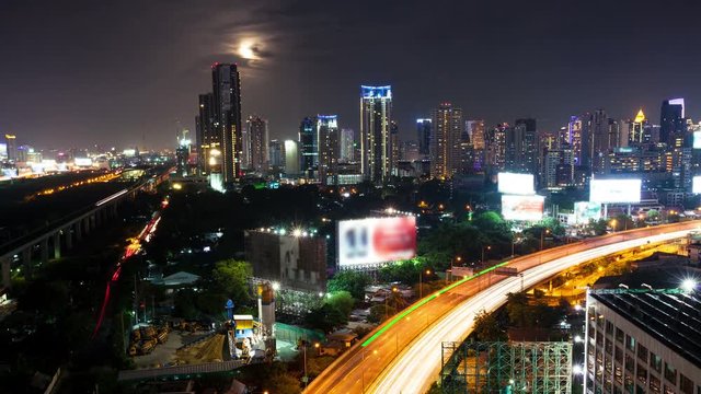 View of Business Building Bangkok city area with transportation road near and moon floating in 4K, Timelapse (4096 x 2304)