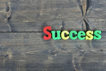 Success on wooden table