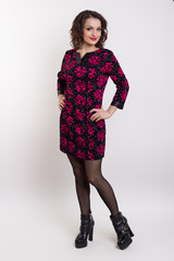 beautiful fashionable sexy girl in a dress for a catalog shoot on a white background