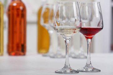 Wine glasses with red and white wine, closeup