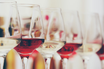Wine glasses with red and white wine, closeup