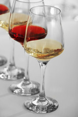 Wine glasses with red and white wine, closeup
