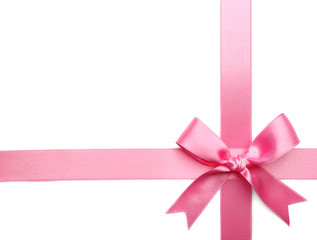 Pink ribbon bow on white background