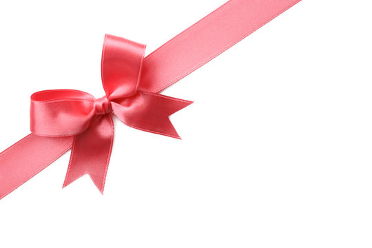Pink ribbon bow on white background