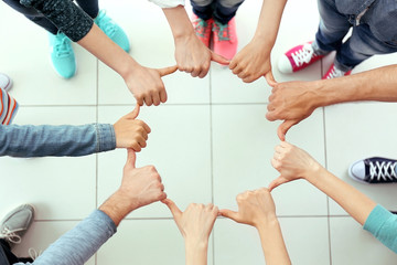 Teamwork concept. United hands, top view