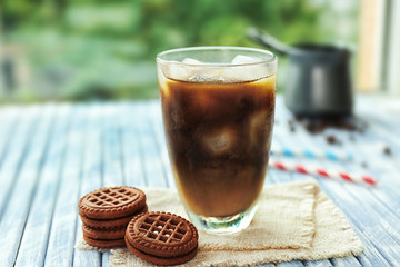 Glass of iced coffee on table