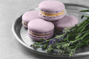 Obraz na płótnie Canvas Delicious macaroons and lavender, closeup