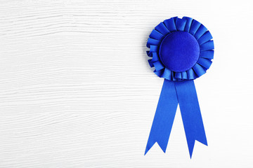 Blue award prize ribbon on grey background
