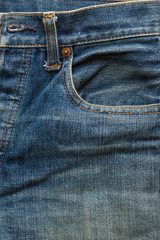 Faded blue jeans front pocket