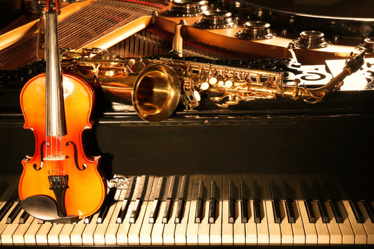 Violin with saxophone and piano, closeup