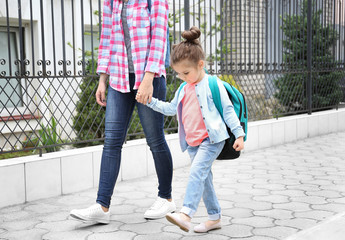 Parent taking child to school