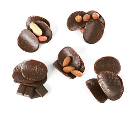 Chocolate chips and different nuts on white background