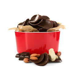 Chocolate chips in red bowl on white background