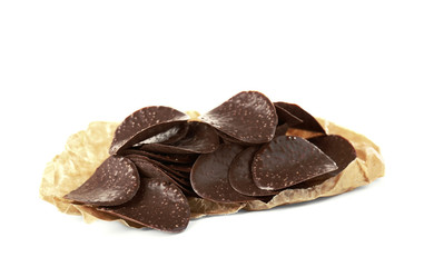 Chocolate chips in parchment on white background