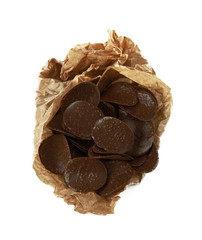 Chocolate chips in parchment on white background