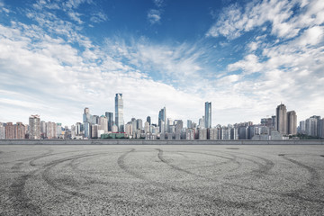 empty road with cityscape and skyline of chongqing in cloud sky