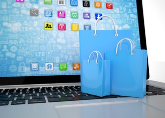 laptop and  shopping pags on white background. 3d rendering.