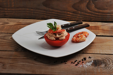 shrimp and tomato dish on wooden background
