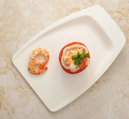 shrimp and tomato dish on marble background