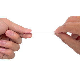 Side view of 2 hands exchange a white card