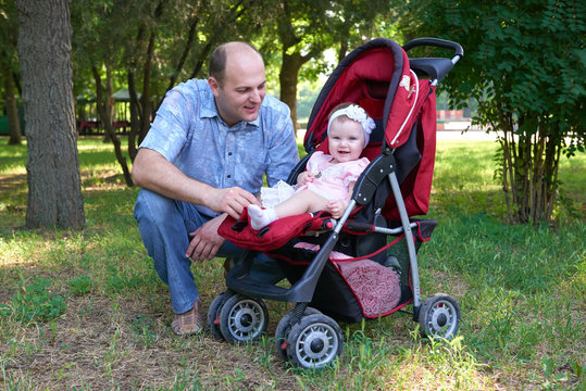 happy father with baby girl portrait in city park, summer season, child and parent