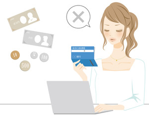 通帳を見る女性　バツ　赤字