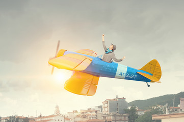 Girl flying old plane . Mixed media