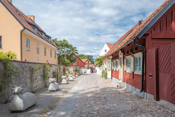 Fototapeta na wymiar Medieval alley in the historic Hanse town Visby on Swedish Baltic sea island Gotland