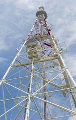 Telecommunication steel lattice tower against the sky
