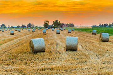 sunset on hay bales