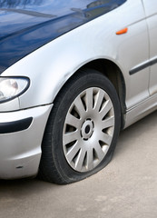 Obraz na płótnie Canvas flat tire of the car