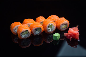 Sushi set on a black background. 