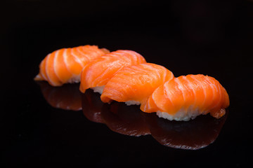 Sushi set on a black background. 