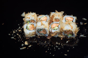 Sushi set on a black background. 