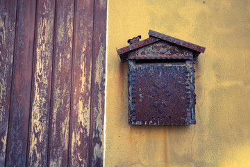 detail from an old mailbox in Burano island, Venice (vintage effect)